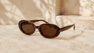 Editorial oval Havana acetate sunglasses with dark-brown lenses