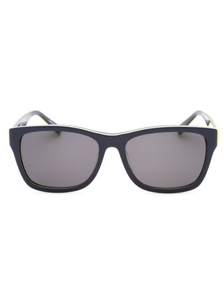Lacoste L683S sunglasses with black frames, blue lenses, and purple temple accents.